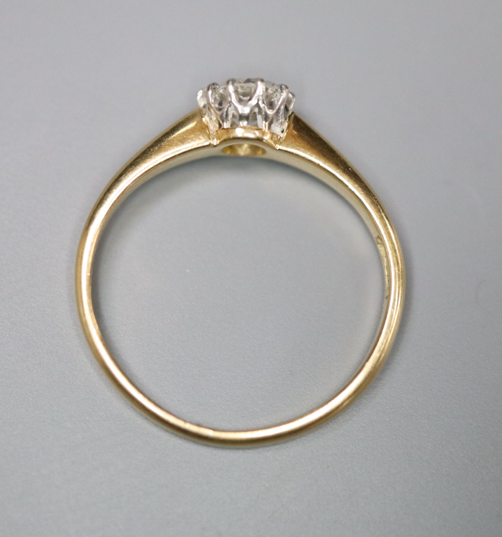 An 18ct and solitaire diamond ring, size G, gross 1.7 grams.